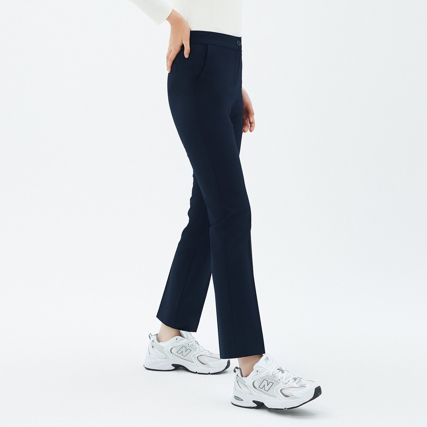 Image of Side view of TUL Women’s Side Hidden Banding Pants in Mir Navy, showcasing the discreet elastic waistband and sleek, straight-leg fit.