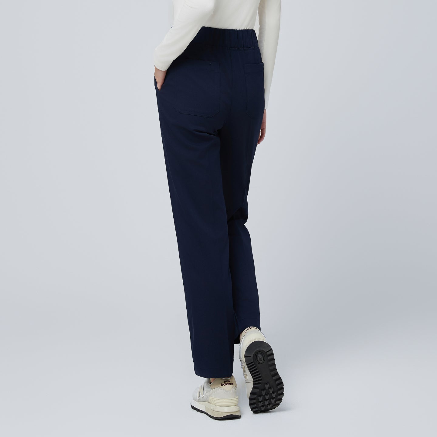 Image of Side angle of TUL Women's Premium Banding Pants in Mir Navy, highlighting the discreet premium banding and sleek design.