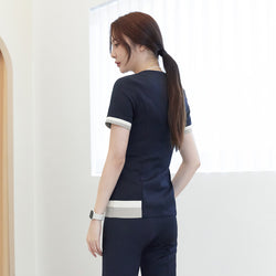 Image of Back view of TUL NS-168 Navy scrub top, highlighting subtle check pattern accents and a tailored fit.