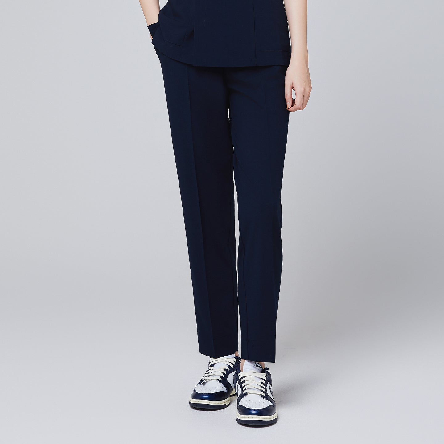 Women's Pocket Banding Pants in Navy with matching scrub top and matching navy sneakers,Navy