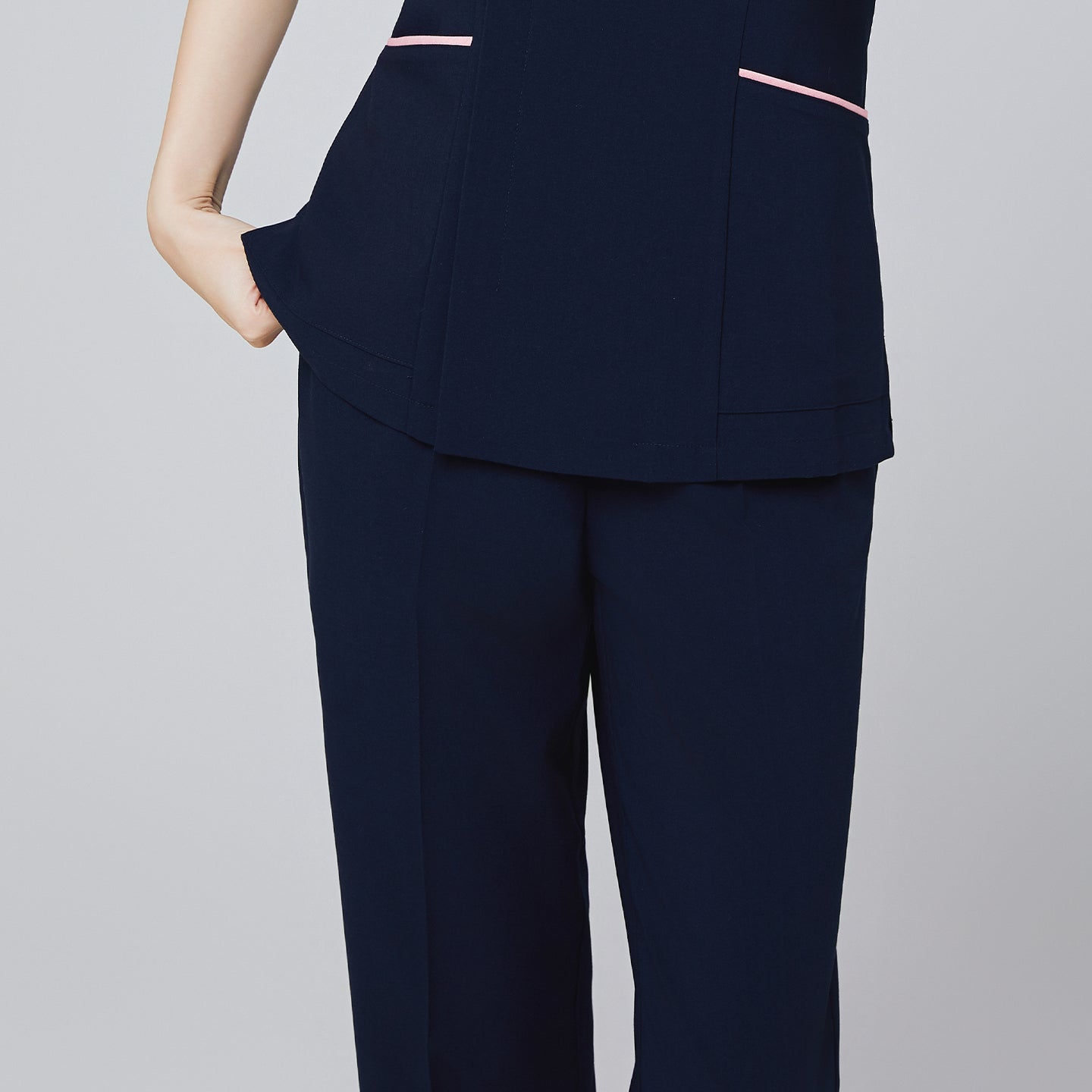 Image of Women's Pocket Banding Pants in Navy with matching scrub top and matching navy sneakers,Navy