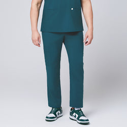 Image of Ocean teal straight scrub pants with side pockets and matching ocean teal scrub top, with teal sneakers,Ocean teal