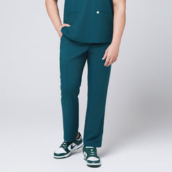 Image of Ocean teal straight scrub pants with side pockets and matching ocean teal scrub top, with teal sneakers,Ocean teal