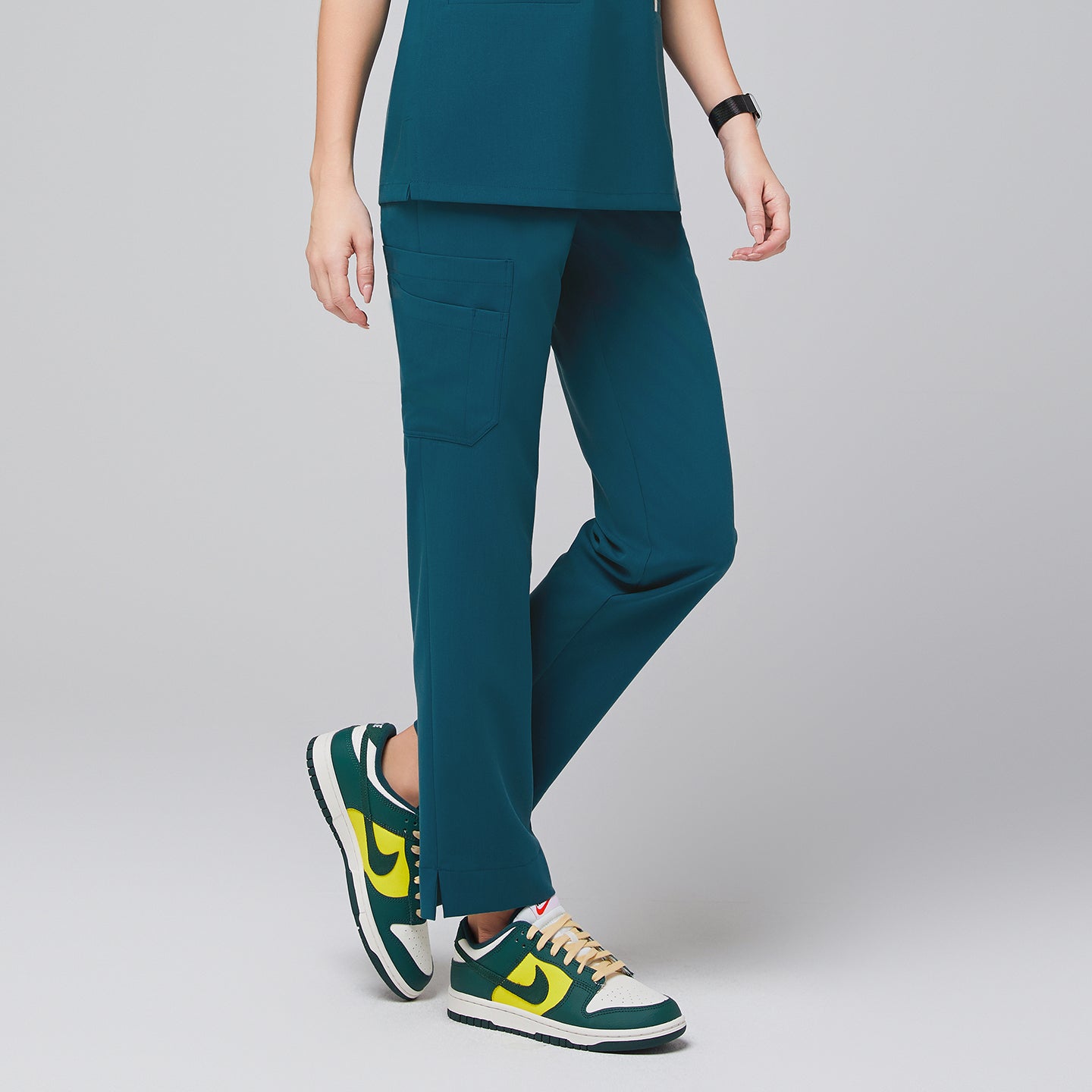 Image of Ocean Teal Straight Split Hem Scrub Pants crafted from smooth stretch fabric, featuring a straight-leg design with subtle ankle slit for ease of movement.