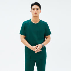 Image of Front view of TUL DS-191 Men's Round Snap Zipper Scrub Top in Pine Green, showcasing a snap collar detail and modern silhouette.
