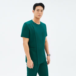 Image of Side angle of TUL DS-191 Pine Green scrub top, highlighting the round snap neckline, front zipper, and spacious pockets.