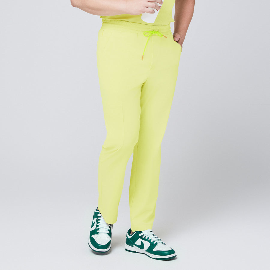 Pineapple yellow straight-leg scrub pants with an adjustable drawstring waistband, paired with matching top and green sneakers,Pineapple Yellow