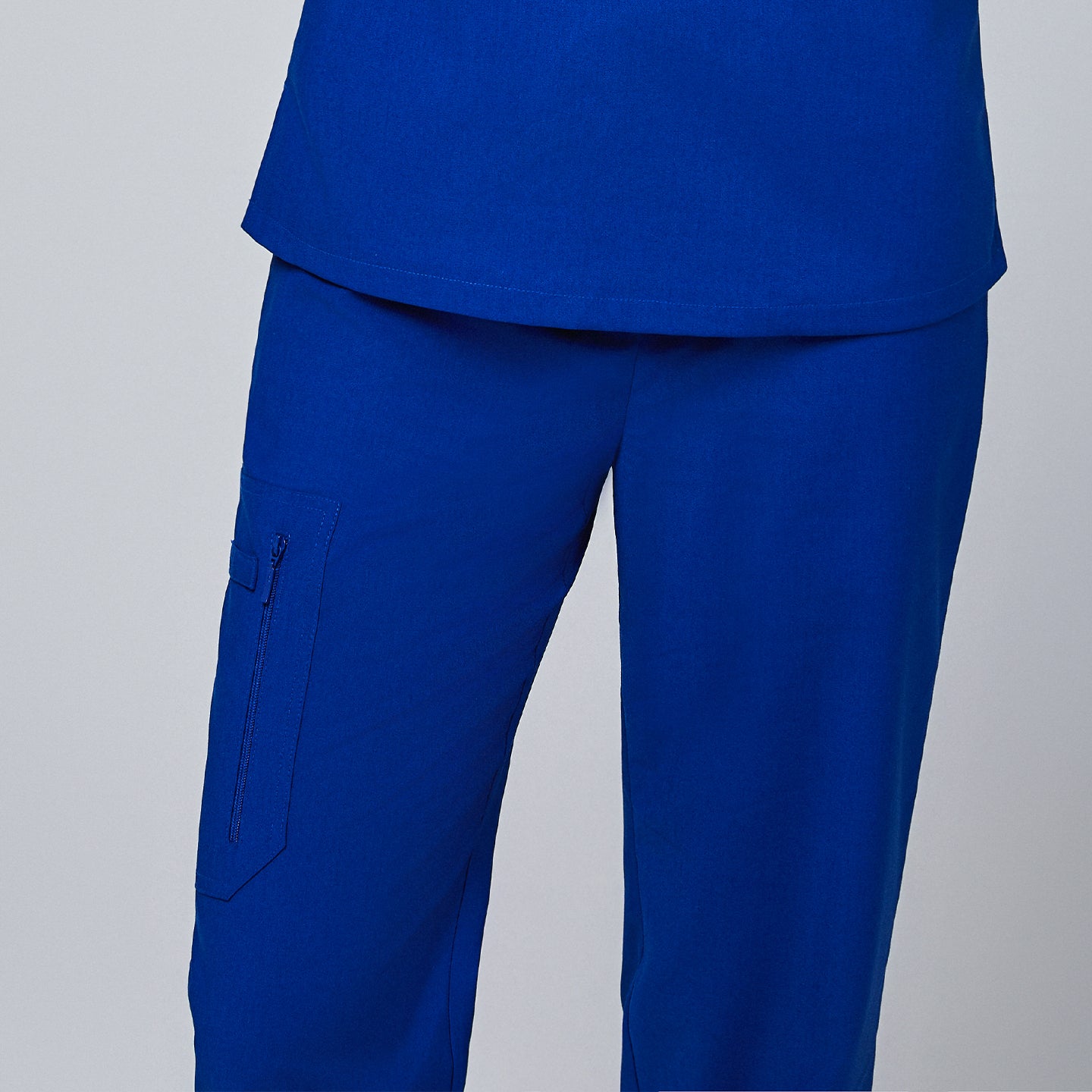 Image of Scrub pants featuring a secure zipper pocket on the leg and a clean, tailored design for a professional appearance,Royal Blue