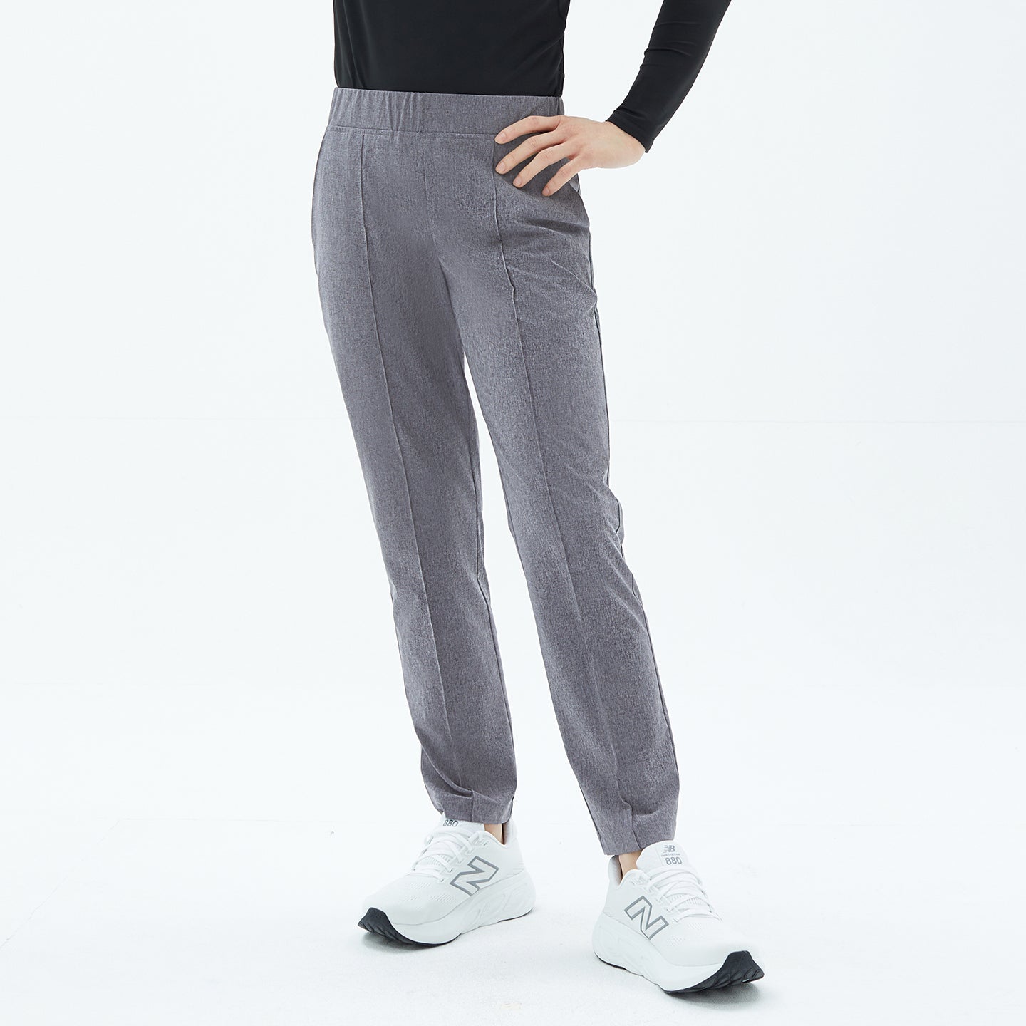 Front view of Soft Gray Men’s Line Banding Pants with a slim straight fit and clean crease detailing, paired with a simple black top.