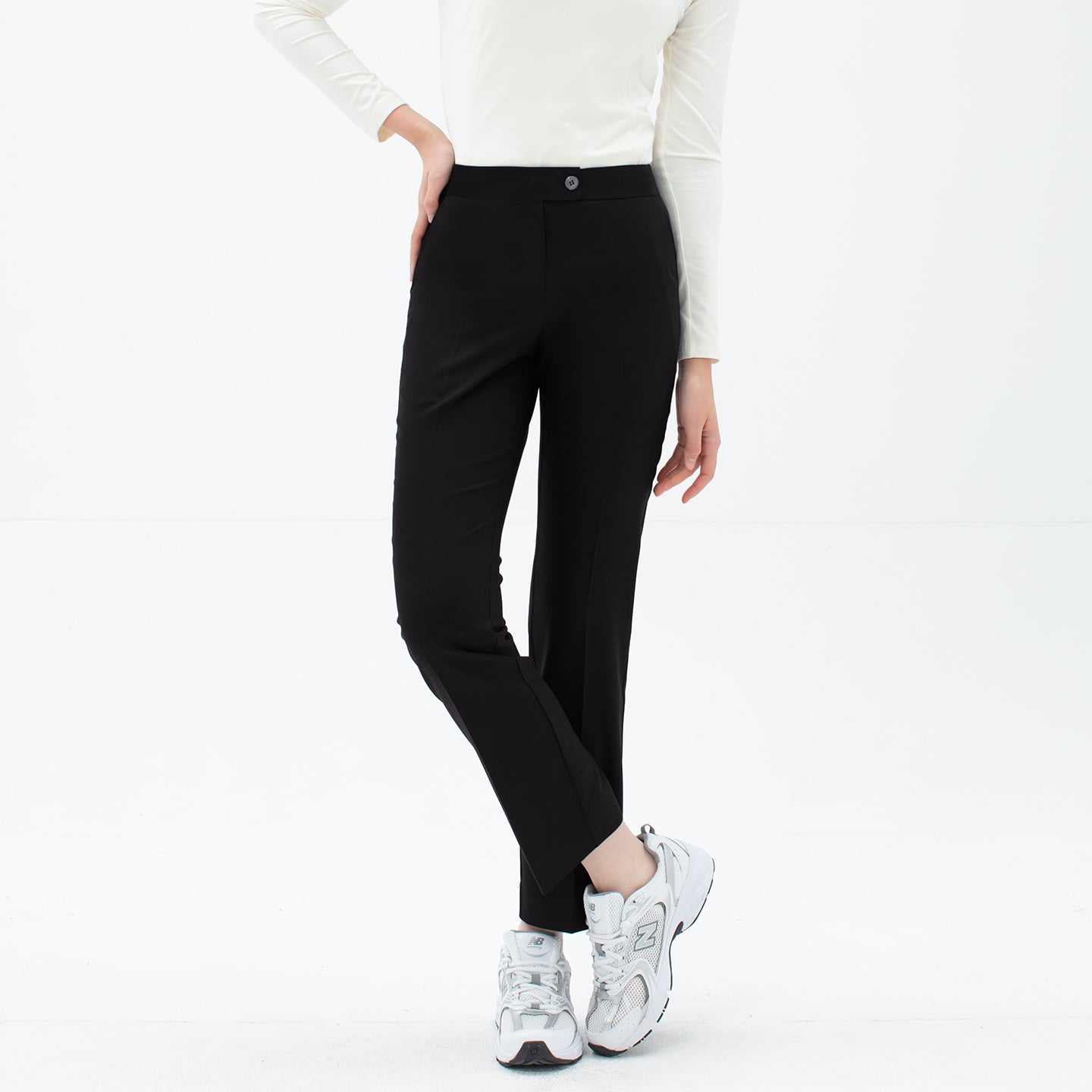 Front view of TUL Women's Comfort Banding Pants in Stretch Black, showing a slim, tailored fit and a button closure.