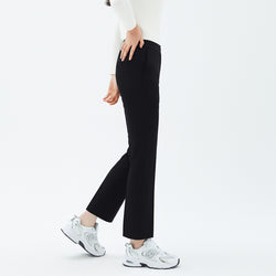Image of Side angle of TUL Women's Comfort Banding Pants in Stretch Black, highlighting a smooth waistband and sleek silhouette.
