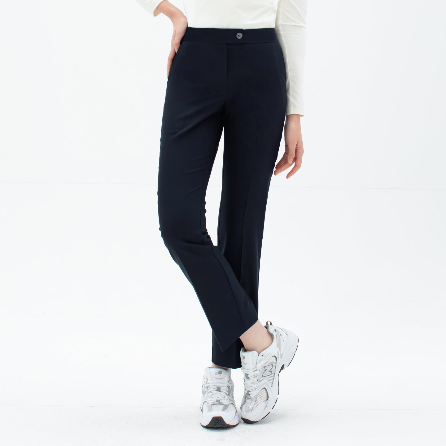 Image of Front view of TUL Women's Comfort Banding Pants in Stretch Navy, featuring a button closure and flexible waistband.
