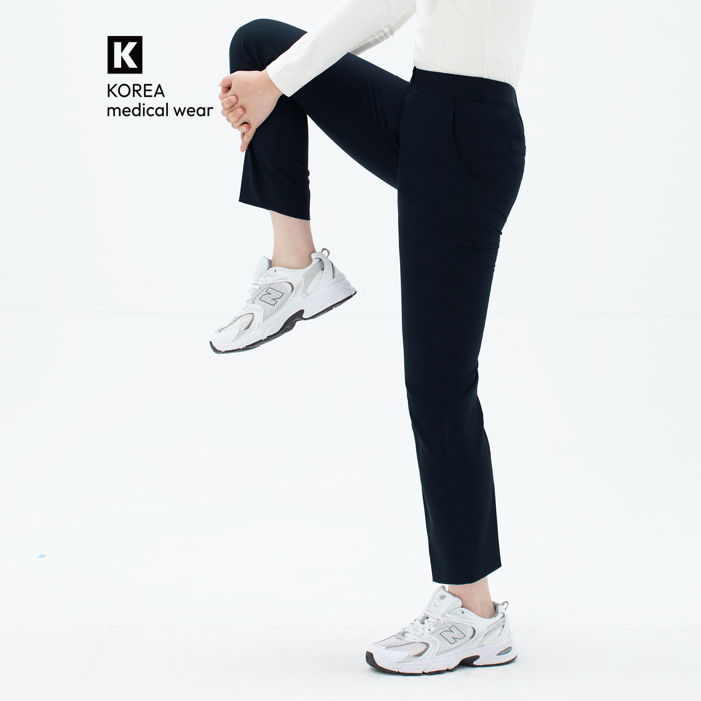 Image of Side view of TUL Women's Comfort Banding Pants in Stretch Navy, showing a flexible waistband and comfortable, tapered fit.