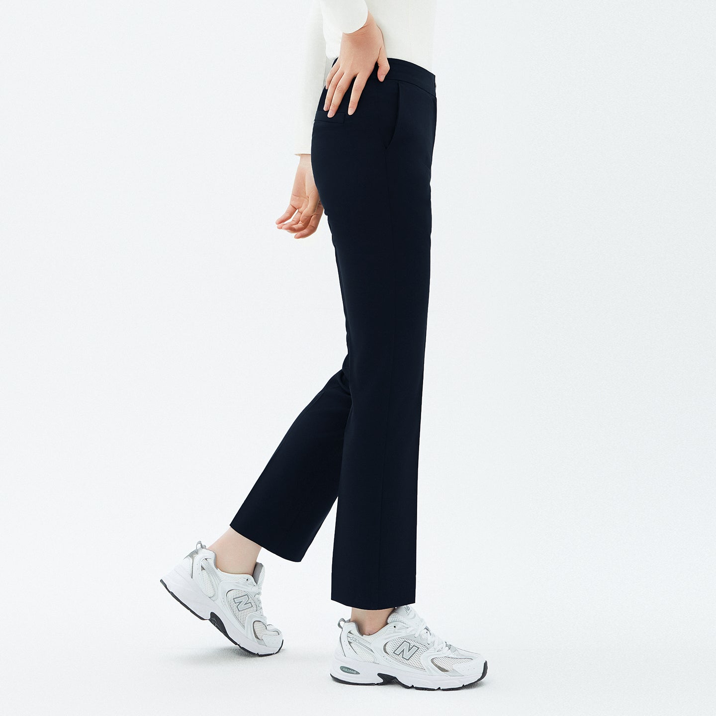 Image of Side angle of TUL Women's Comfort Banding Pants in Stretch Navy, showcasing a tapered leg and comfortable stretch fabric.