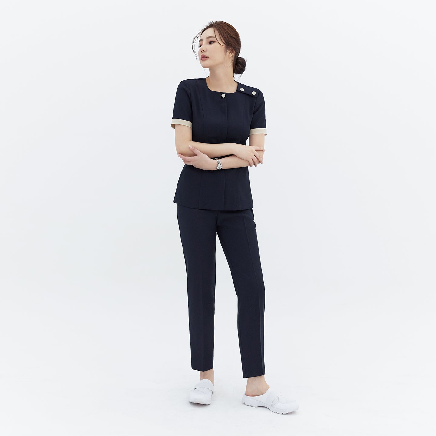 Image of Full-length shot of TUL NCS-01 Women’s Classic Accent Scrub Top in Stretch Navy, paired with matching pants for a cohesive, professional look.