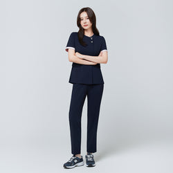 Image of Full-length view of TUL NCS-04 Women’s Blush Edge Scrub Top in Stretch Navy, paired with matching pants for a cohesive uniform.