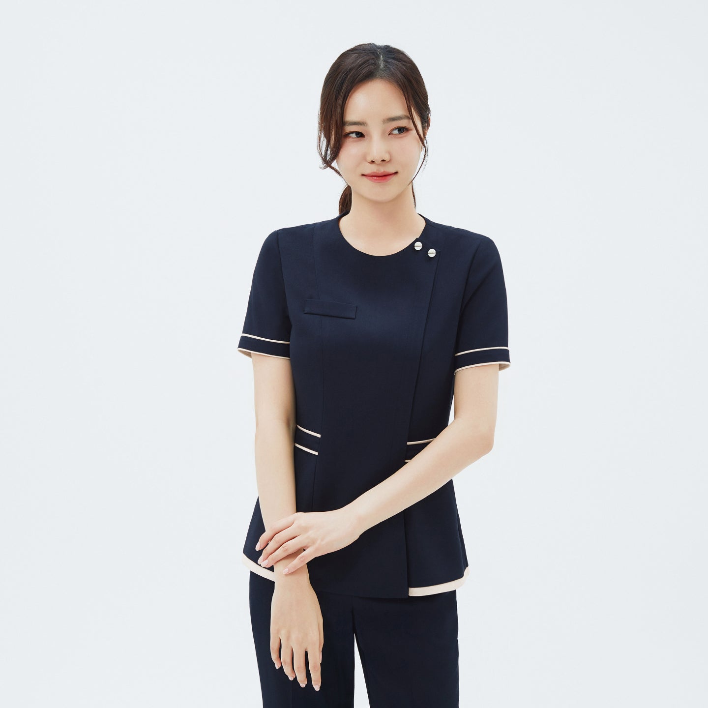 Front view of TUL NCS-07 Women's Ivory Dual Tone Scrub Top in Stretch Navy, showcasing contrasting ivory panels with a tailored fit.