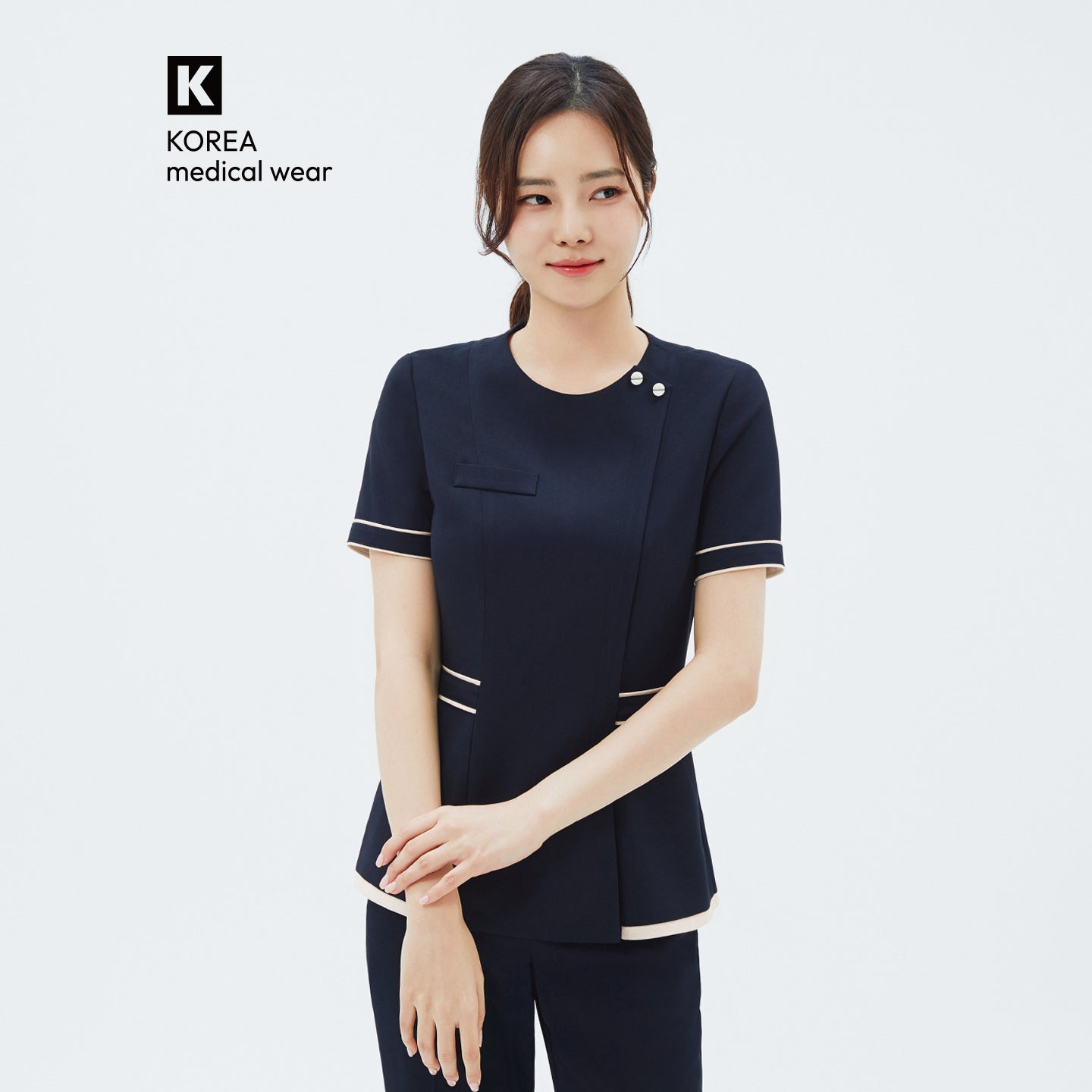 Image of Front view of TUL NCS-07 Women's Ivory Dual Tone Scrub Top in Stretch Navy, showcasing contrasting ivory panels with a tailored fit.