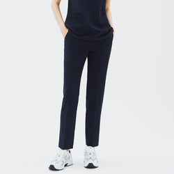 Image of Front view of TUL Women's Style Pants in Stretch Navy, highlighting a slim, tailored leg and practical front pockets.