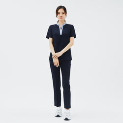 Image of Full-length shot of TUL Women's Style Pants in Stretch Navy, paired with a contrasting collar scrub top for a modern, professional look.