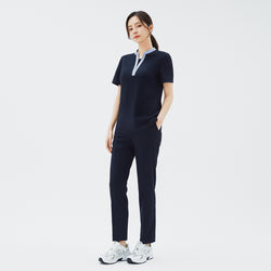 Image of Model wearing TUL Women's Style Pants in Stretch Navy, featuring a refined silhouette and practical pockets for healthcare professionals.