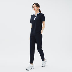 Image of Side angle of TUL Women's Style Pants in Stretch Navy, showcasing the flexible fabric and sleek seam details.