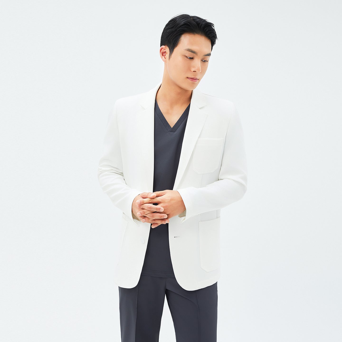 Image of Front view of TUL LCM-12 Men's Short Lab Coat in White Ivory, showing a tailored cut with a notched lapel and a single chest pocket on crisp white fabric.