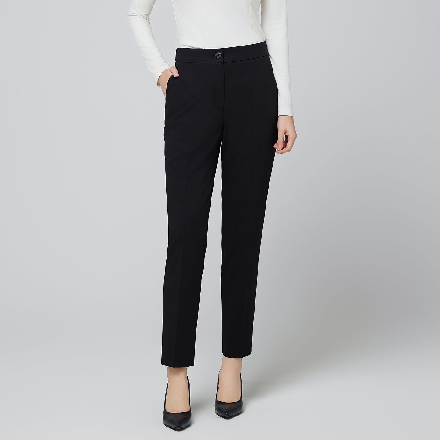Detail shot of the waistband on TUL Women's CS Straight Banding Pants in YT Black, focusing on the smooth, comfortable elastic band and the refined finish of the fabric.
