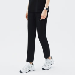 Image of Side angle of TUL Women's CS Straight Banding Pants in YT Black on a model, emphasizing the streamlined leg cut, fabric drape, and precise stitching along the side seams.