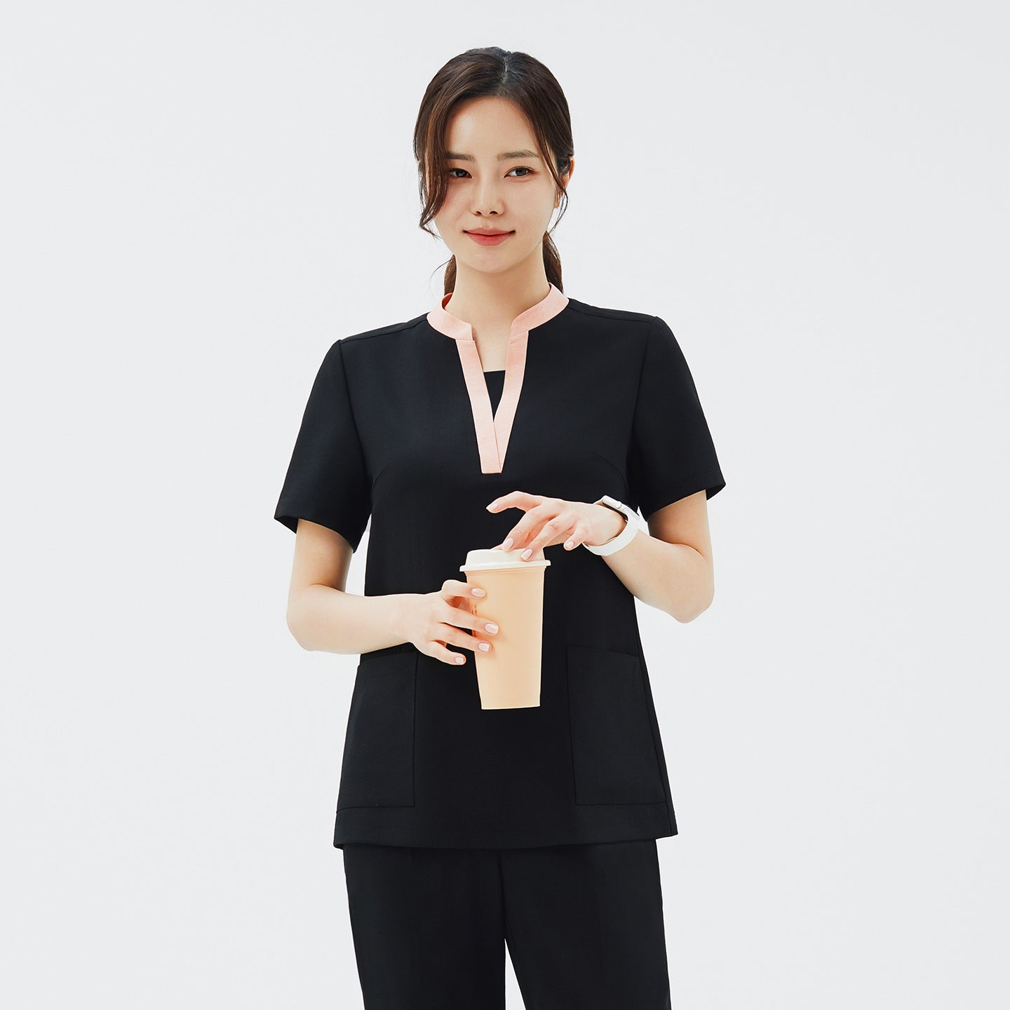 Image of Front view of TUL NS-178 Women's V-Stretch Color Scrub Top in YT Black, showcasing a flattering V-neckline with subtle color accents and a smooth, flexible fabric texture.
