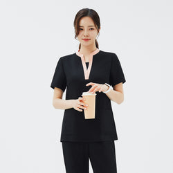 Image of Front view of TUL NS-178 Women's V-Stretch Color Scrub Top in YT Black, showcasing a flattering V-neckline with subtle color accents and a smooth, flexible fabric texture.
