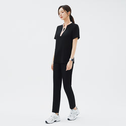 Image of Side view of TUL NS-178 Women's V-Stretch Color Scrub Top in YT Black, showcasing a tailored fit, flexible stretch material, and contemporary design details that enhance its professional look in clinical settings.