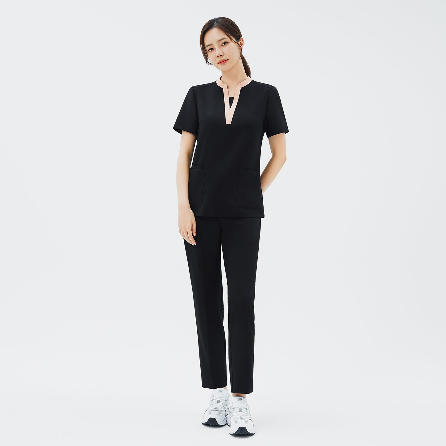 Front view of TUL NS-178 Women's V-Stretch Color Scrub Top in YT Black, featuring a flattering V-neckline with subtle color accents on high-quality stretch fabric ideal for modern healthcare professionals.