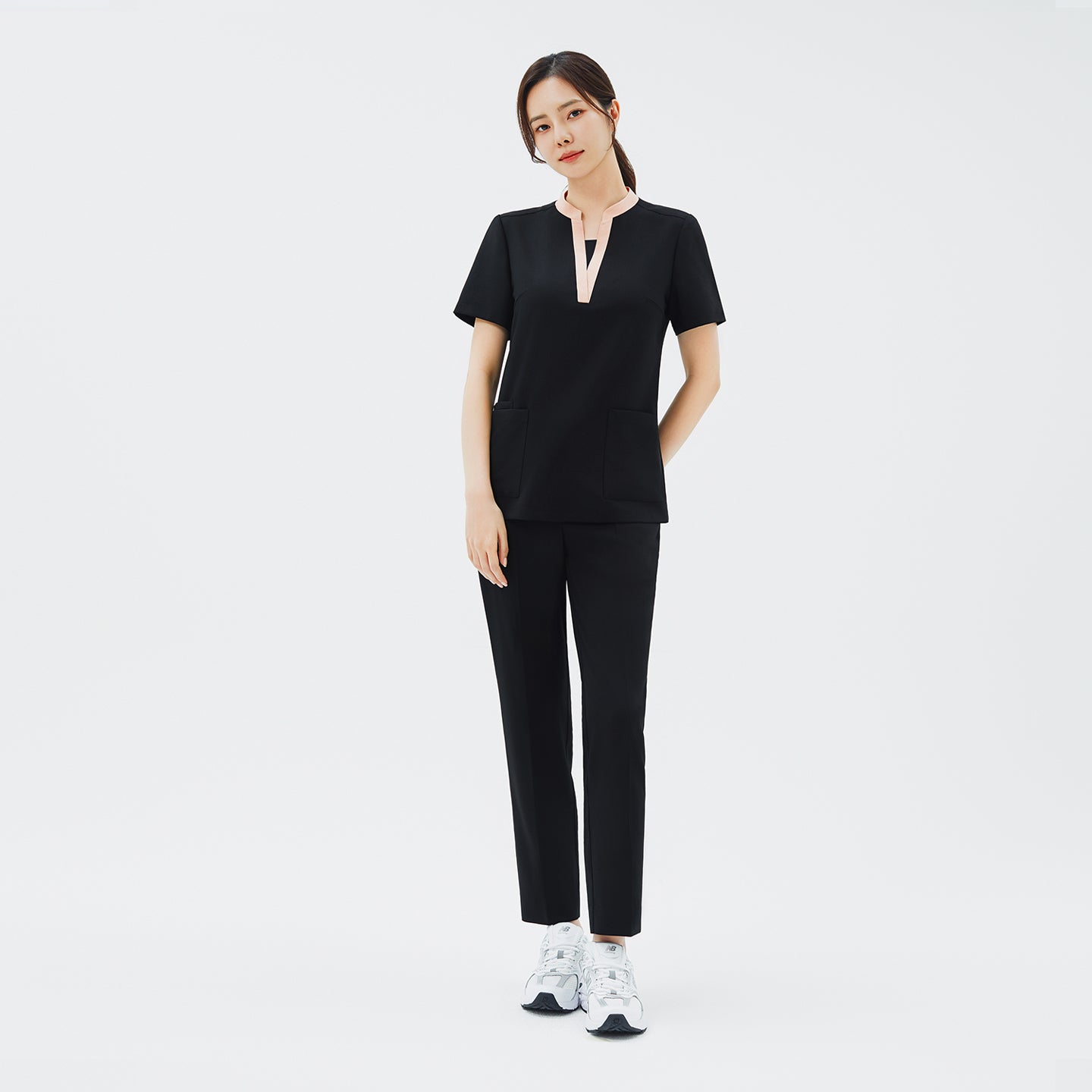Image of Front view of TUL NS-178 Women's V-Stretch Color Scrub Top in YT Black, featuring a flattering V-neckline with subtle color accents on high-quality stretch fabric ideal for modern healthcare professionals.