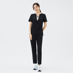 Image of Front view of TUL NS-178 Women's V-Stretch Color Scrub Top in YT Black, featuring a flattering V-neckline with subtle color accents on high-quality stretch fabric ideal for modern healthcare professionals.